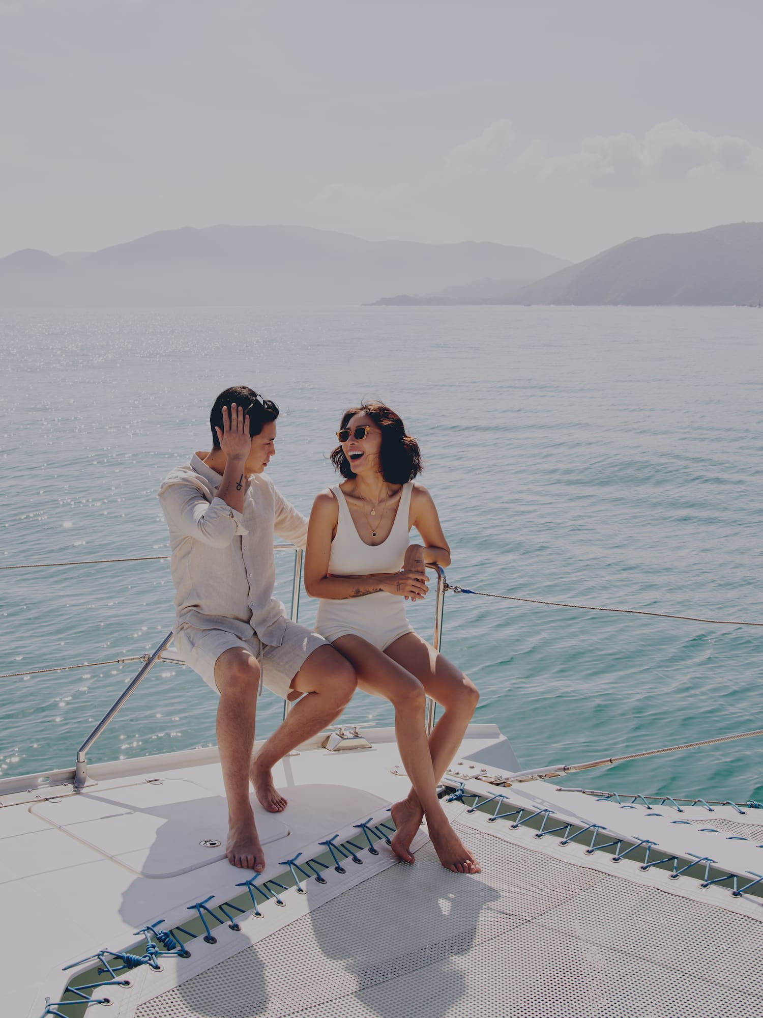 a man and woman sitting on a boat