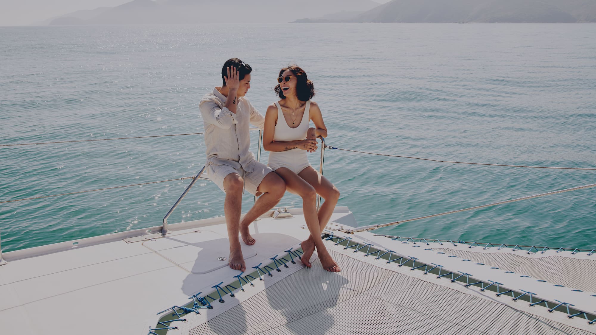 a man and woman sitting on a boat