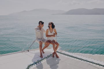 a man and woman sitting on a boat