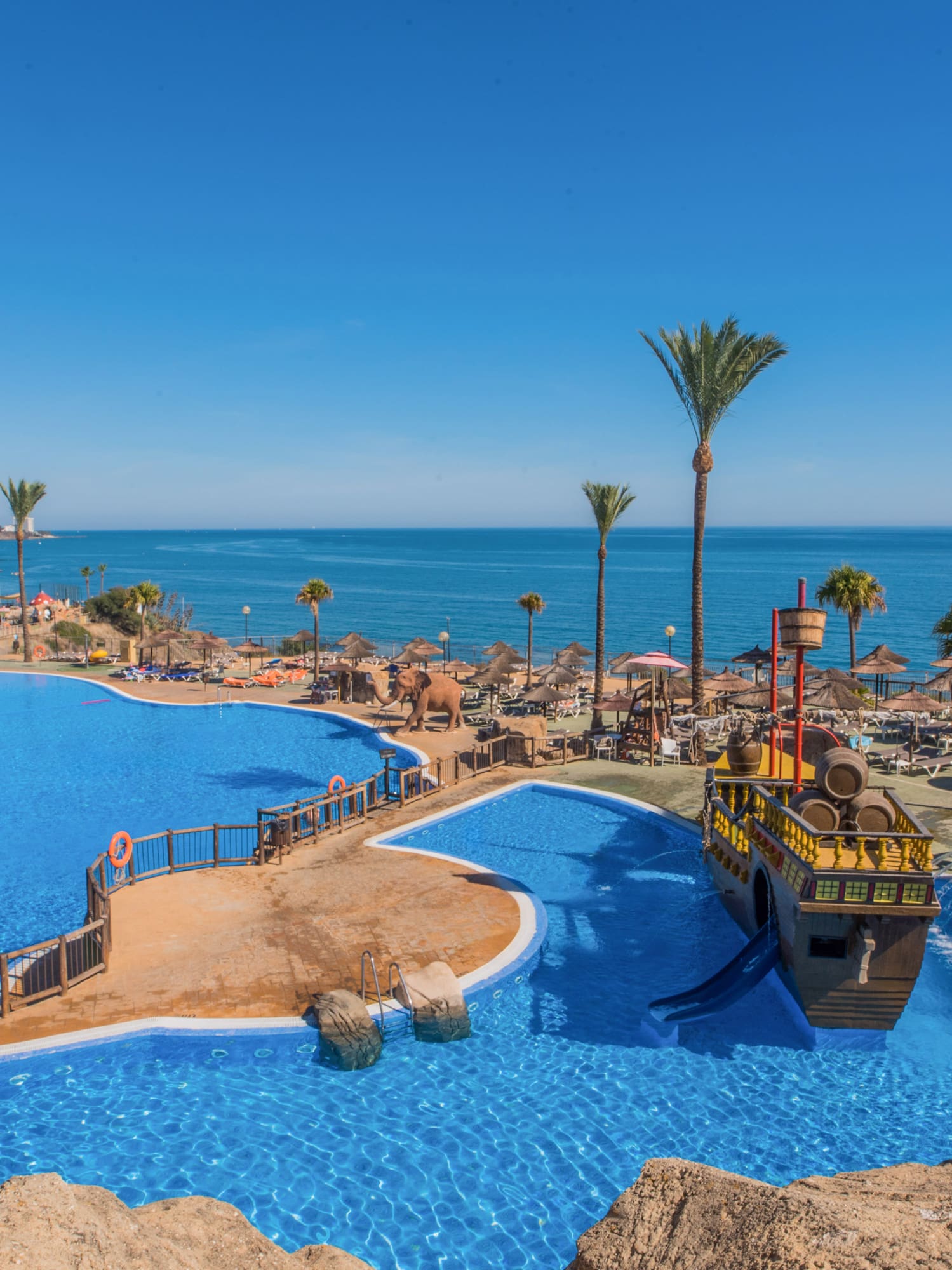 a water park with a boat and a ship