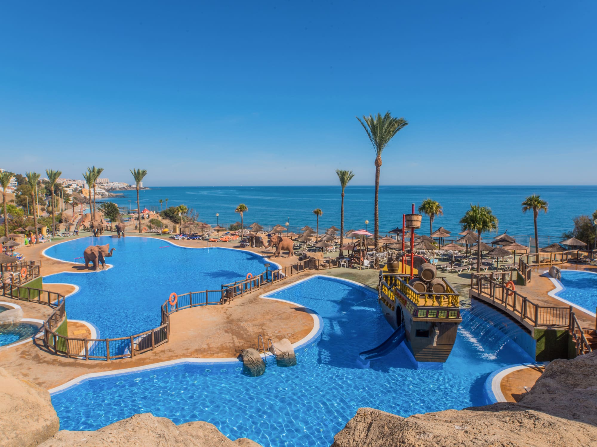 a water park with a boat and a ship