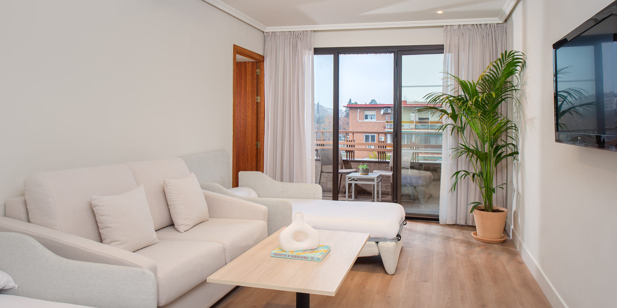 a living room with couches and a table