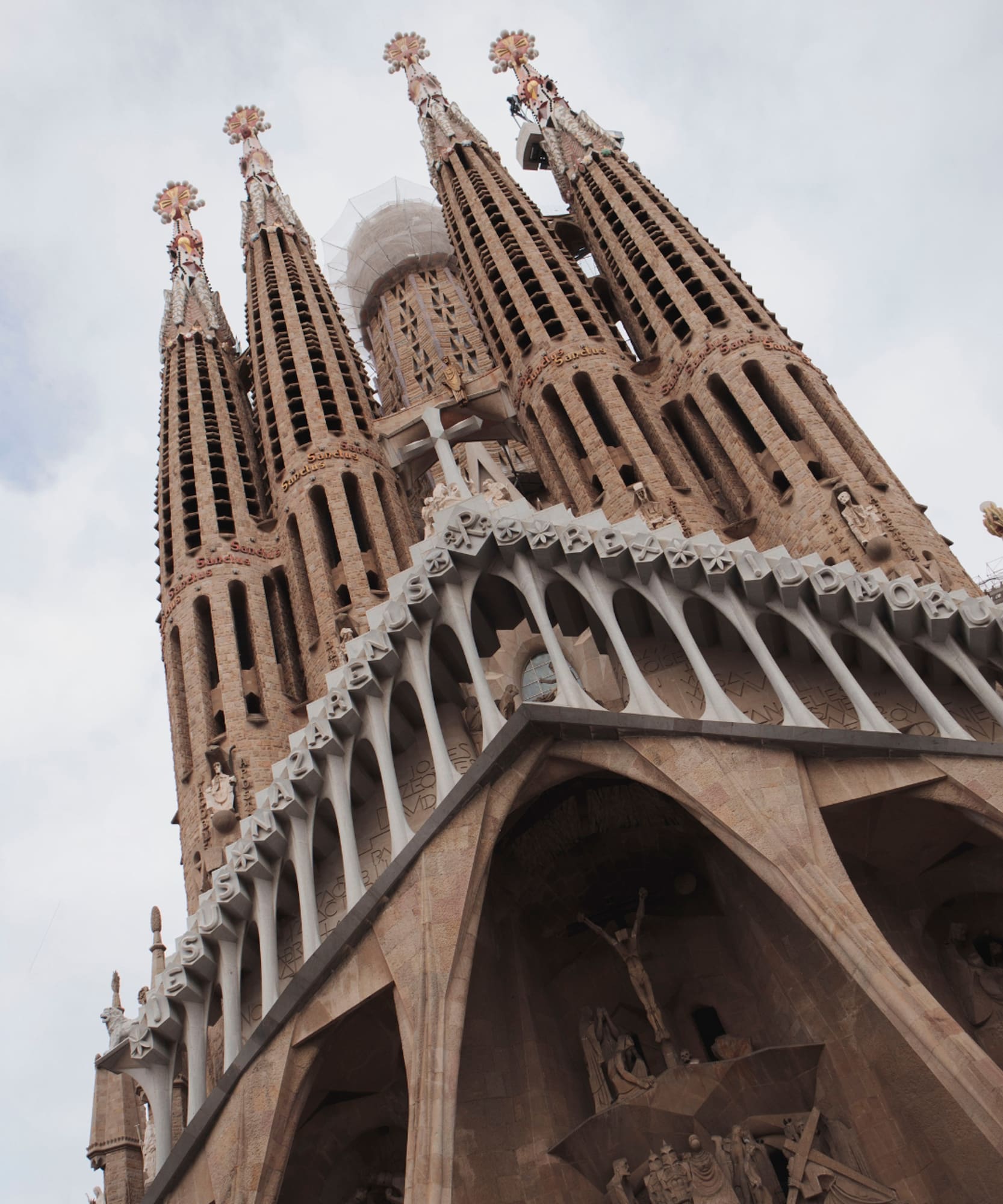 a tall building with towers and crosses
