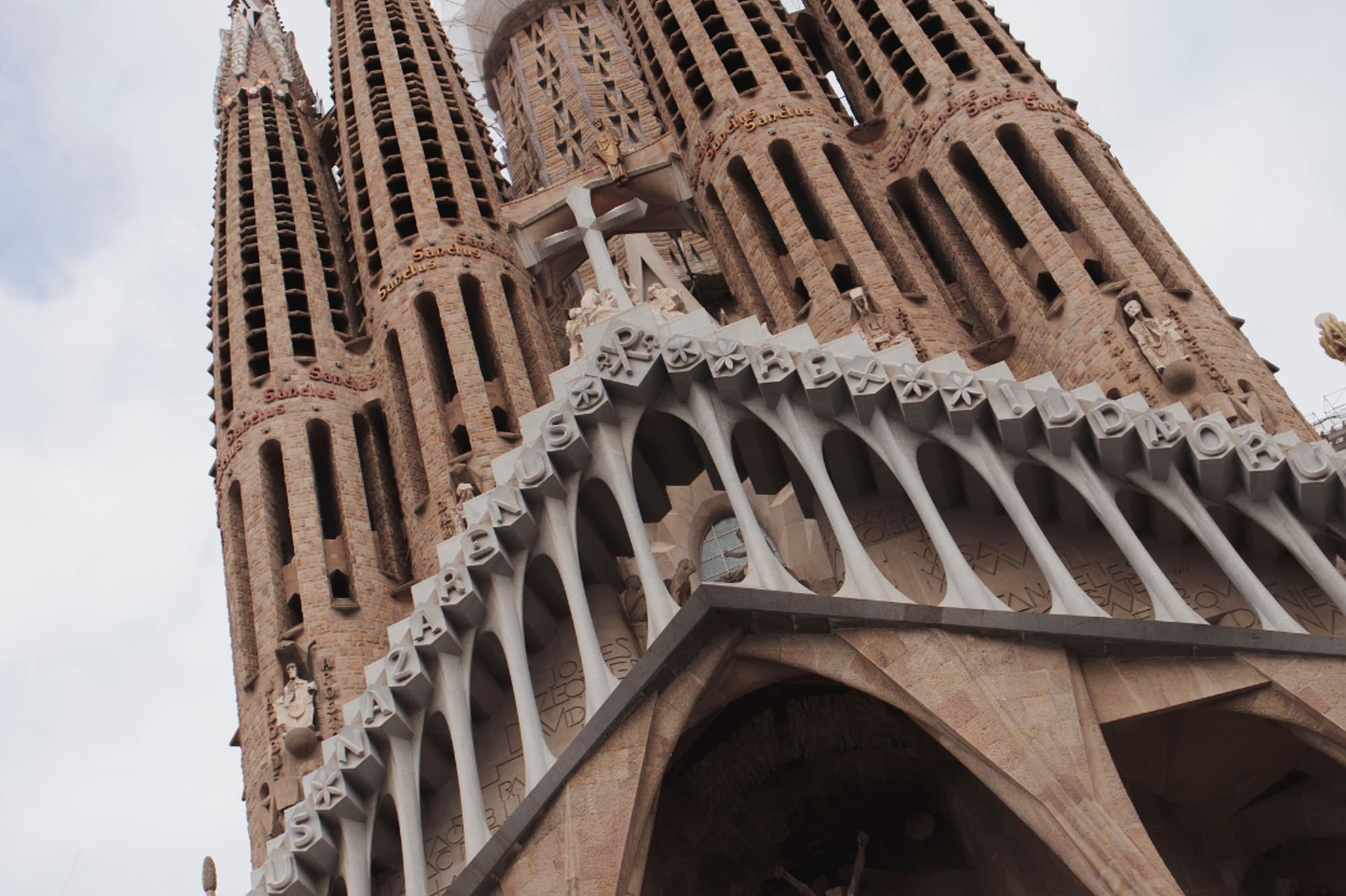 a tall building with towers and crosses