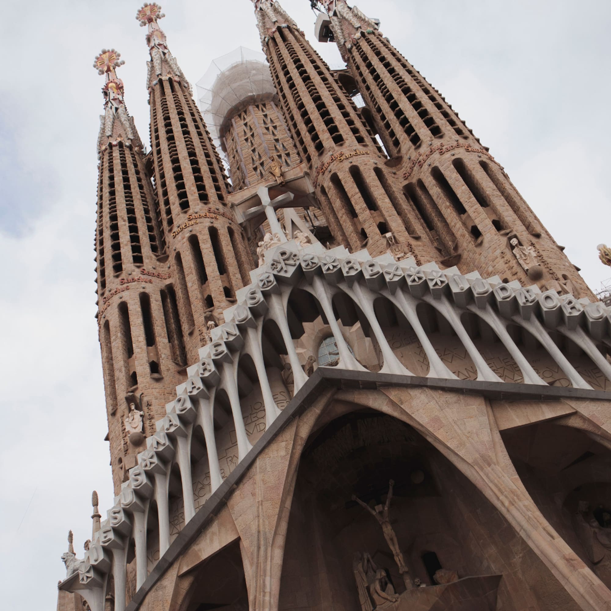 a tall building with towers and crosses