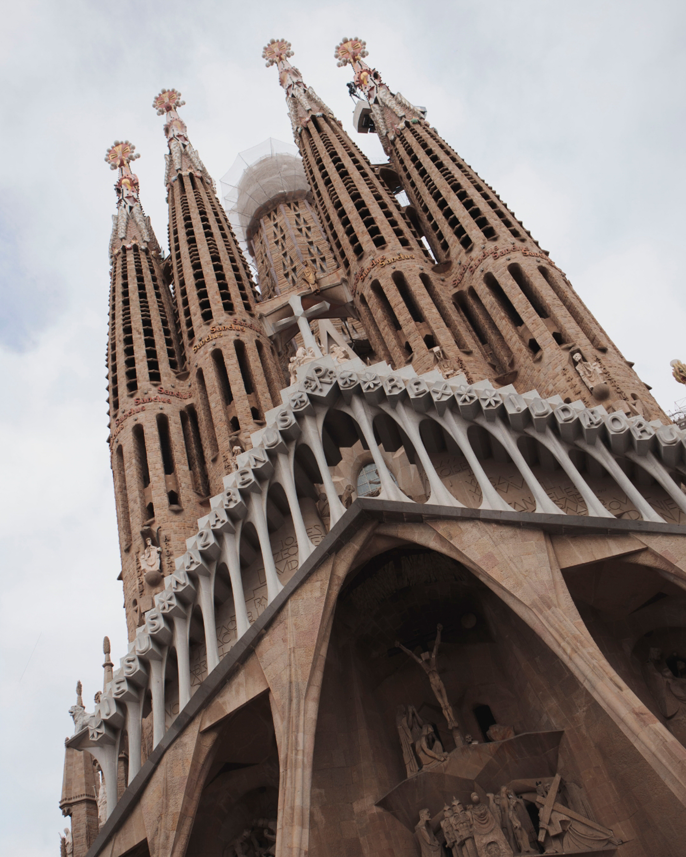 a tall building with towers and crosses