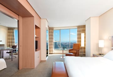 a room with a large window and a bed