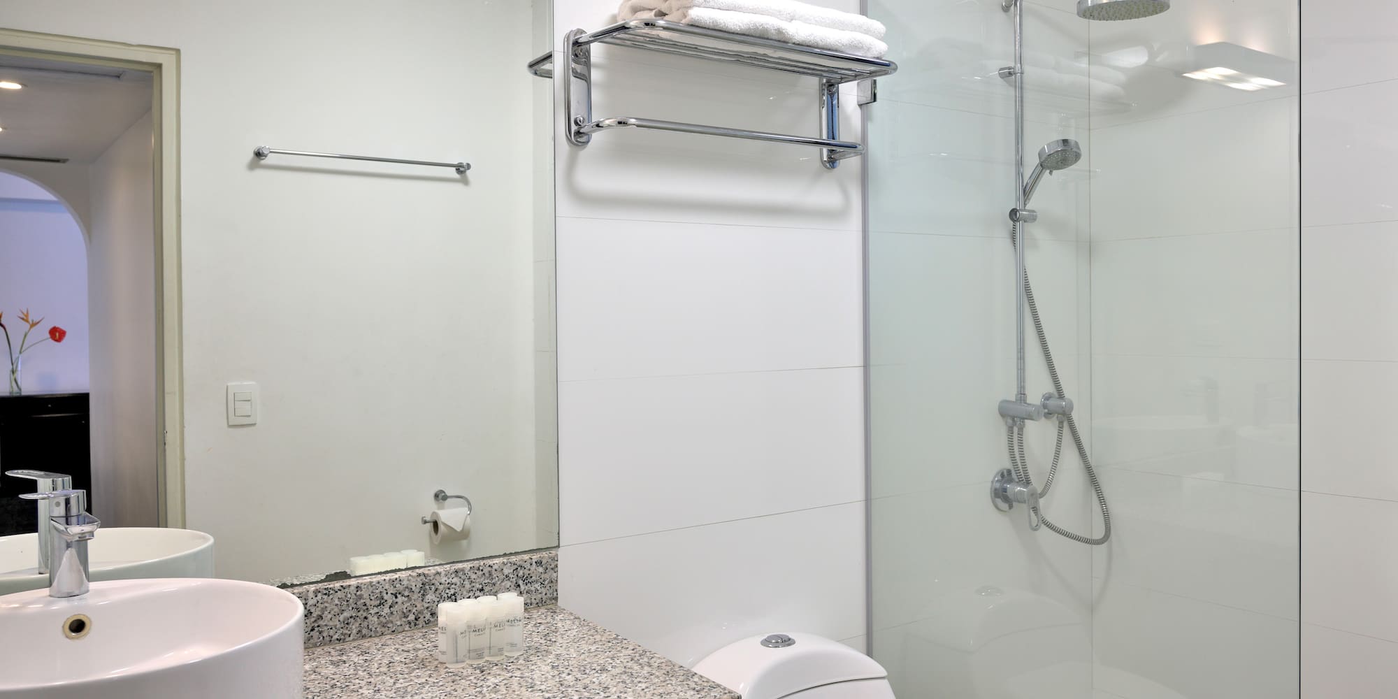 a bathroom with a shower and sink