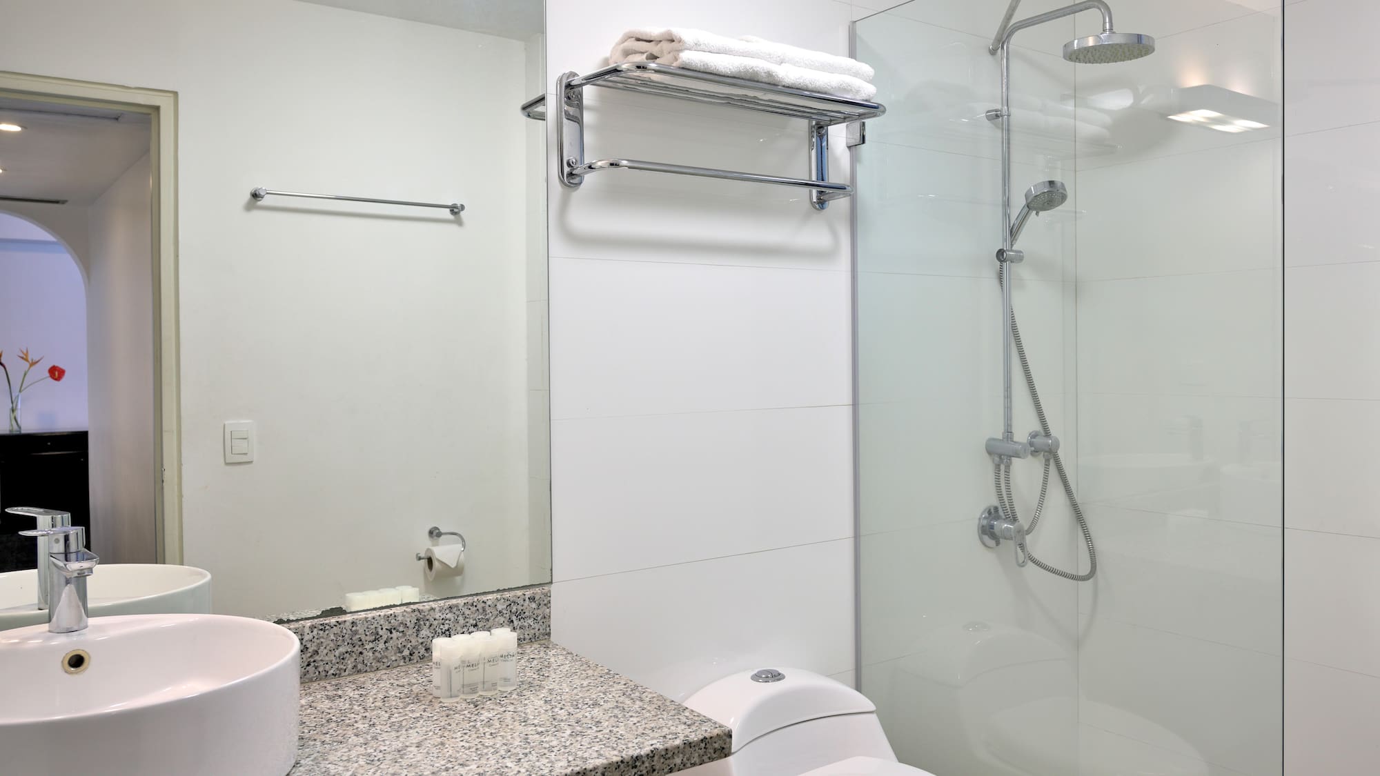 a bathroom with a shower and sink