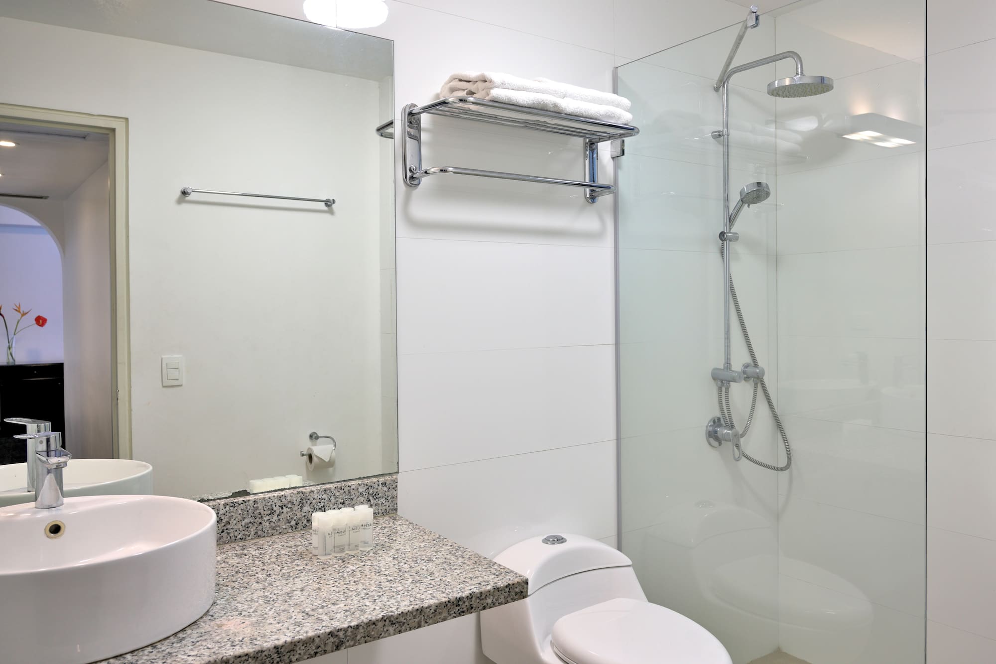 a bathroom with a shower and sink