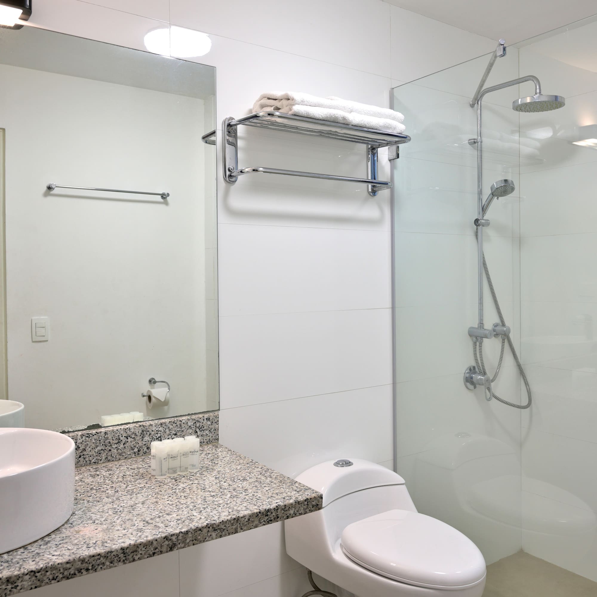 a bathroom with a shower and sink