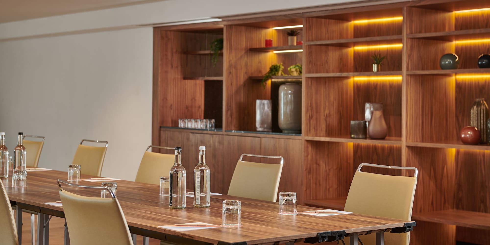 a table with chairs and bottles on it