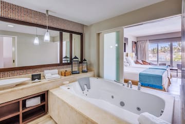 a bathroom with a bathtub and a mirror