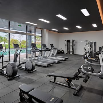 a large room with exercise equipment