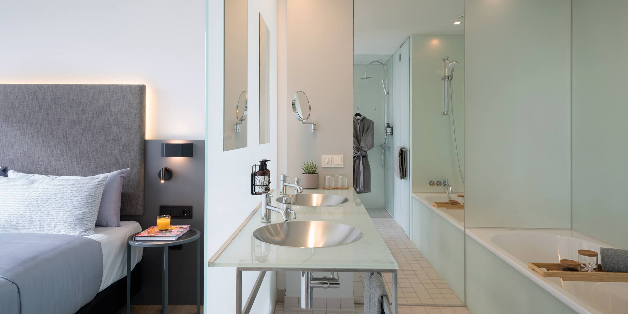 a bathroom with a bed and a bathtub