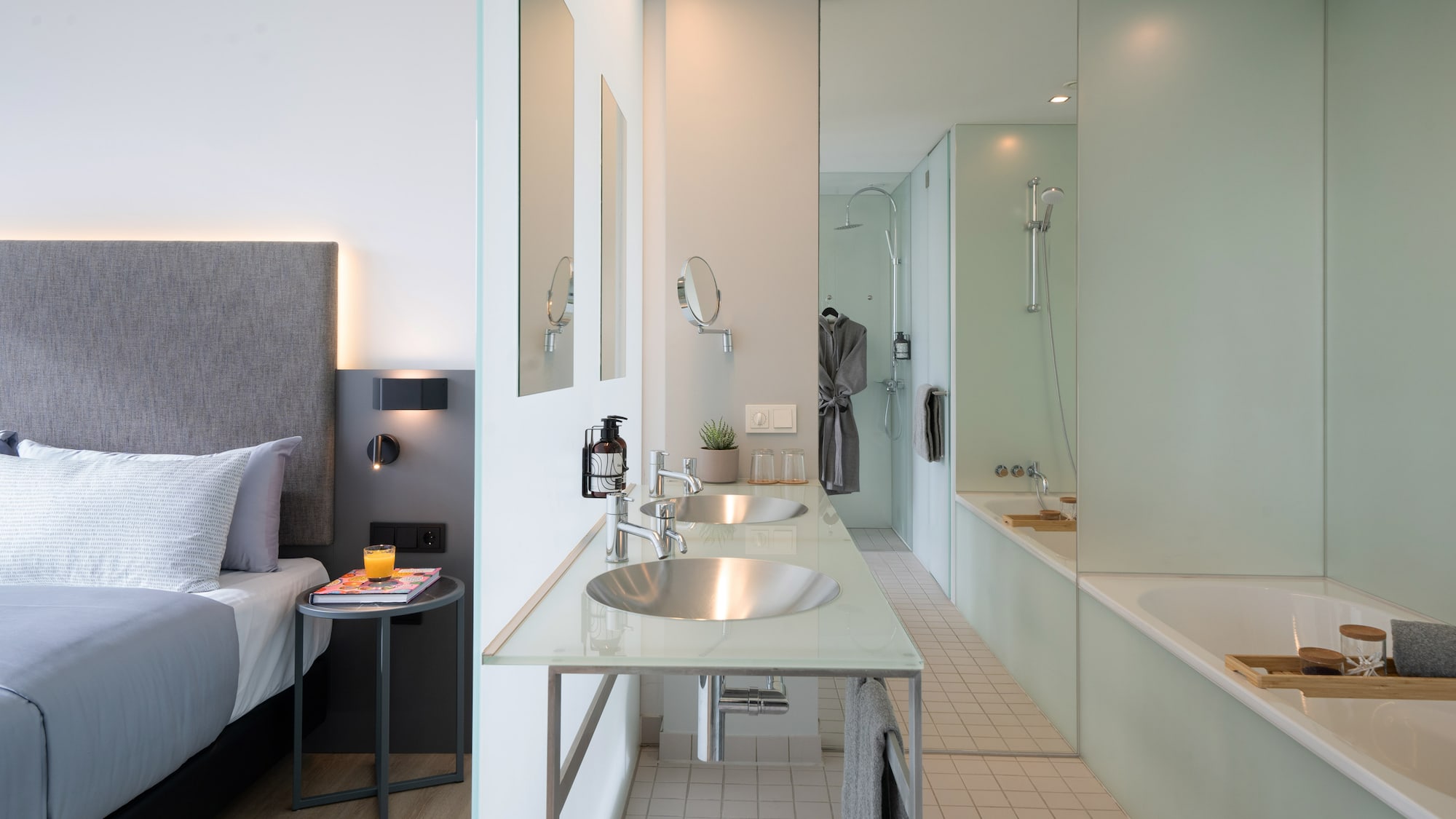 a bathroom with a bed and a bathtub