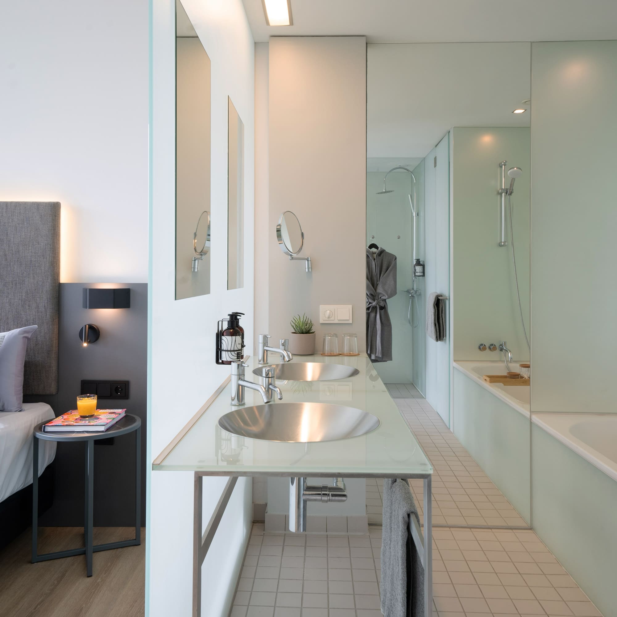 a bathroom with a bed and a bathtub