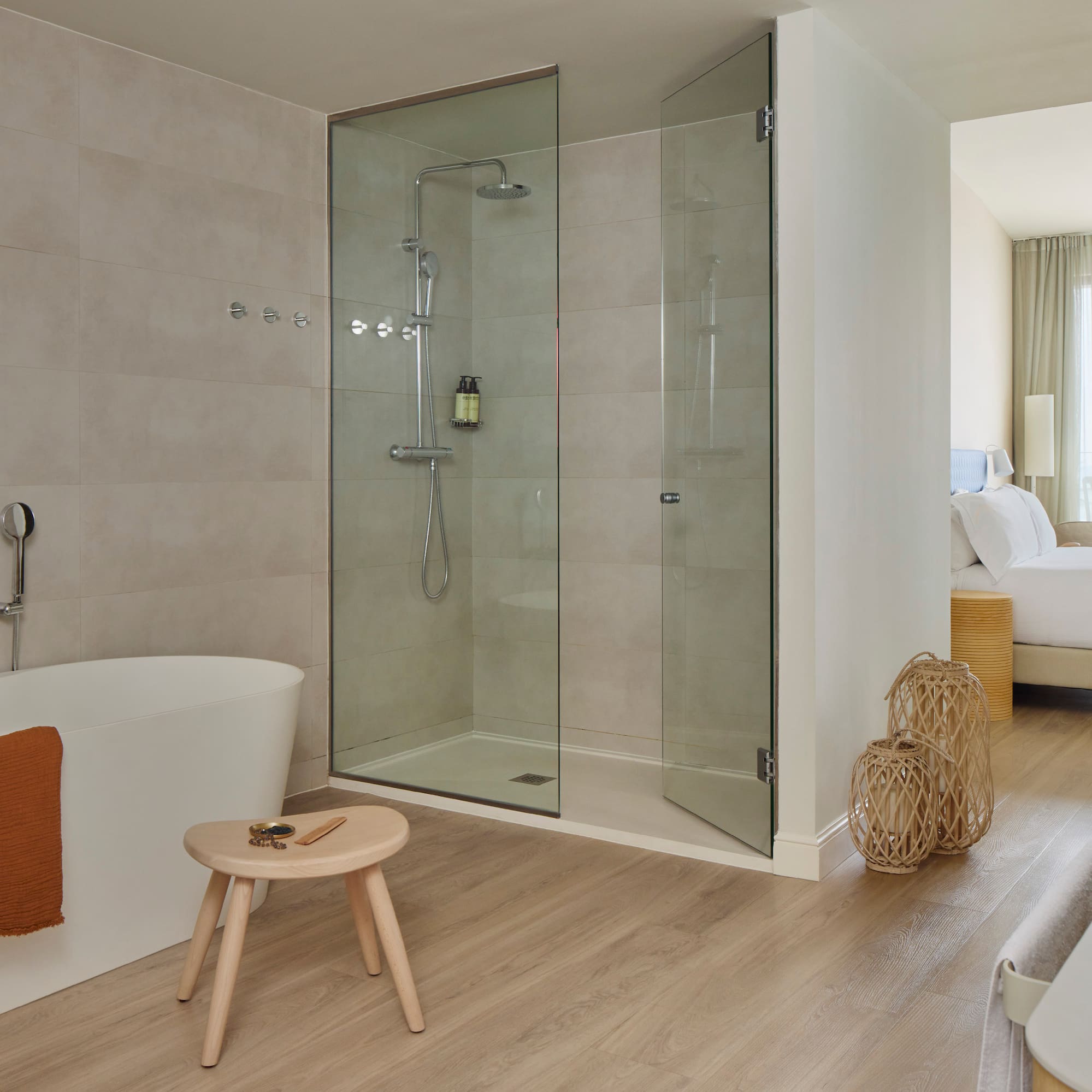 a bathroom with a glass shower and a bathtub