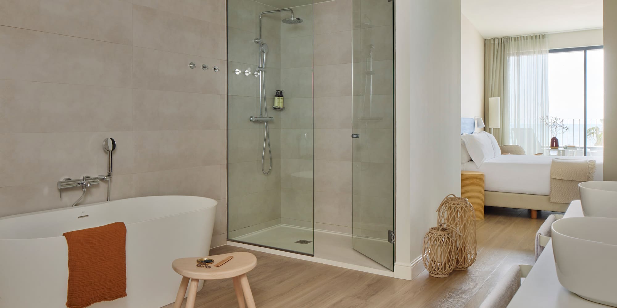 a bathroom with a glass shower and a bathtub