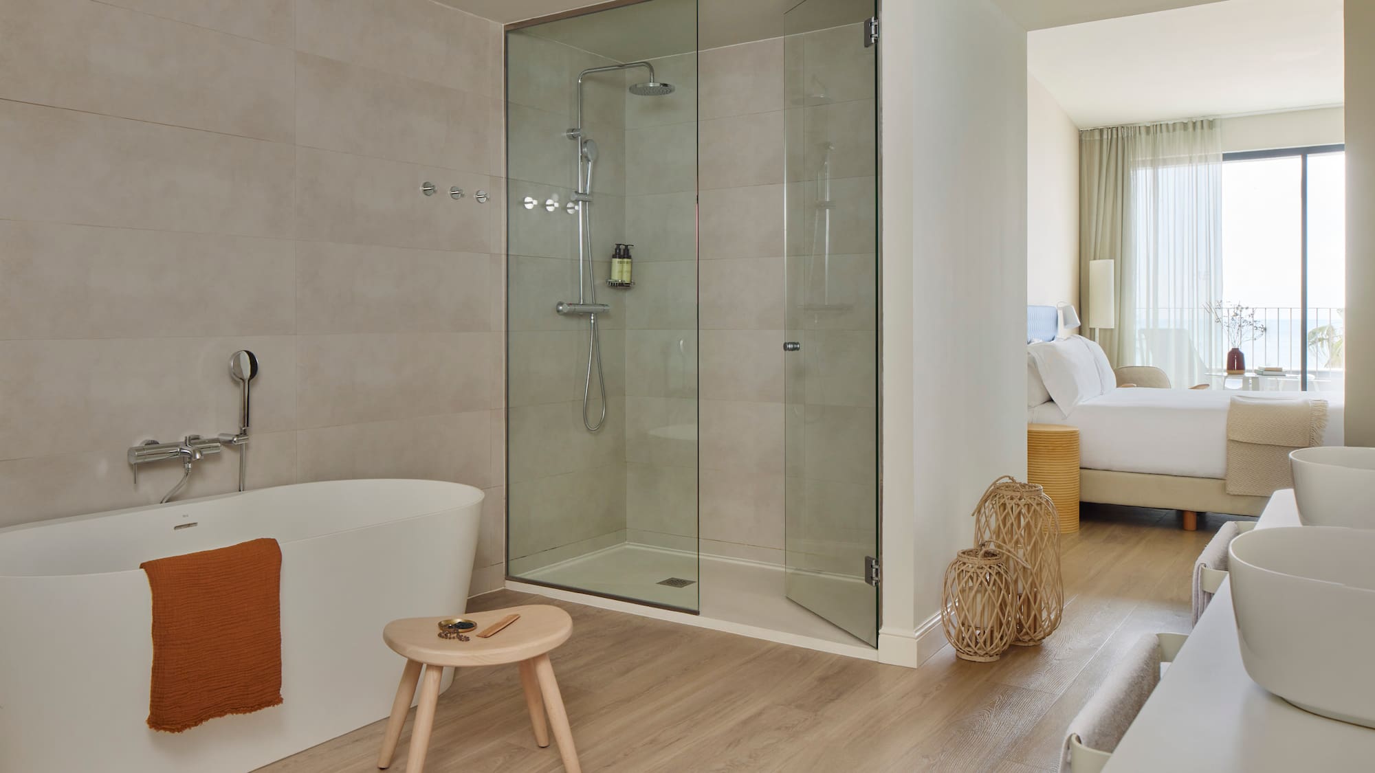 a bathroom with a glass shower and a bathtub