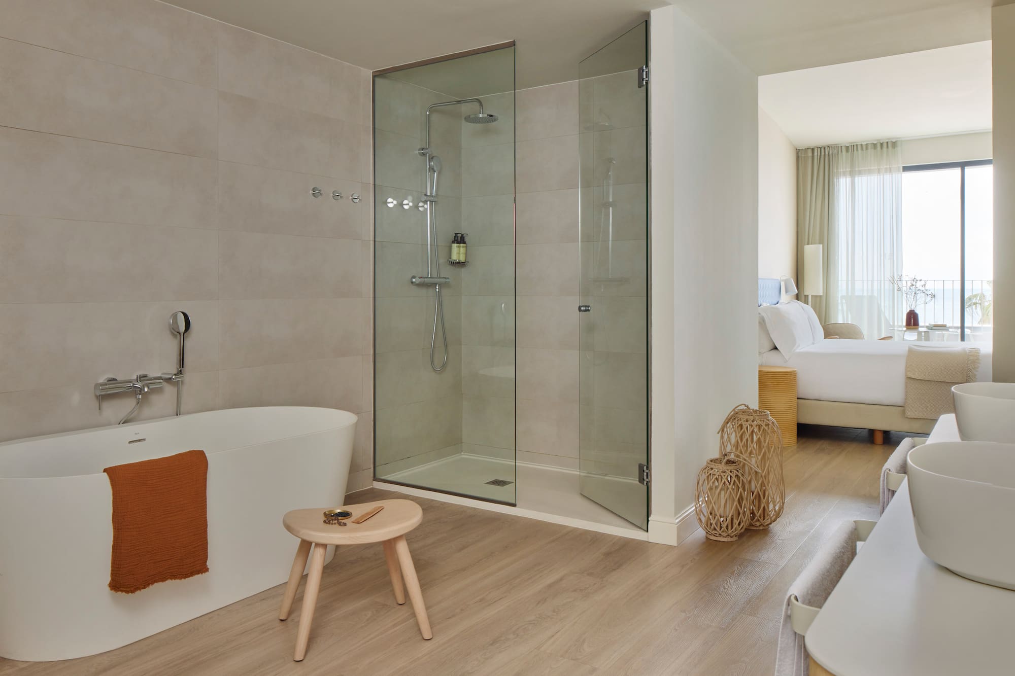 a bathroom with a glass shower and a bathtub