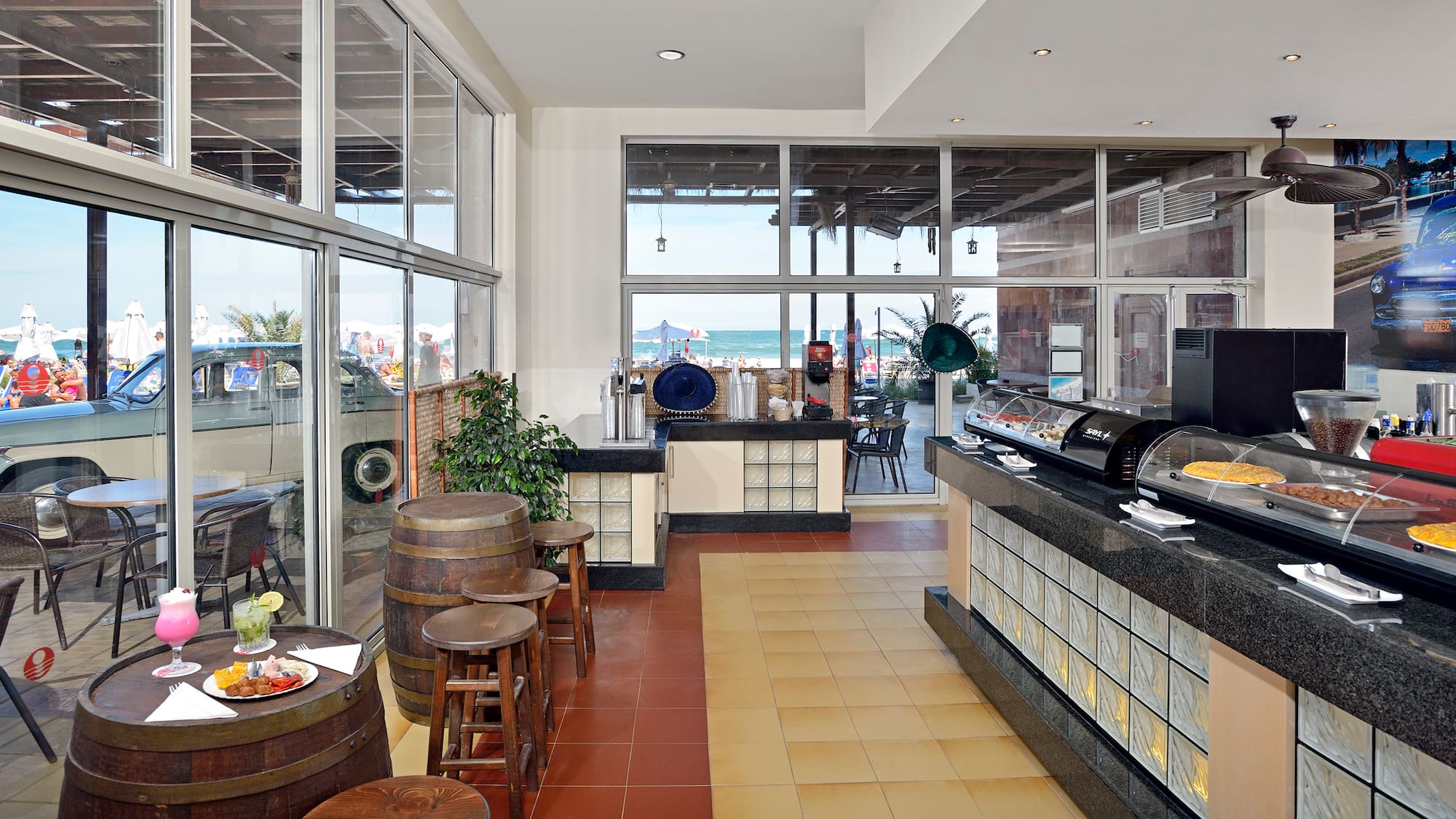 a room with a buffet and a large window