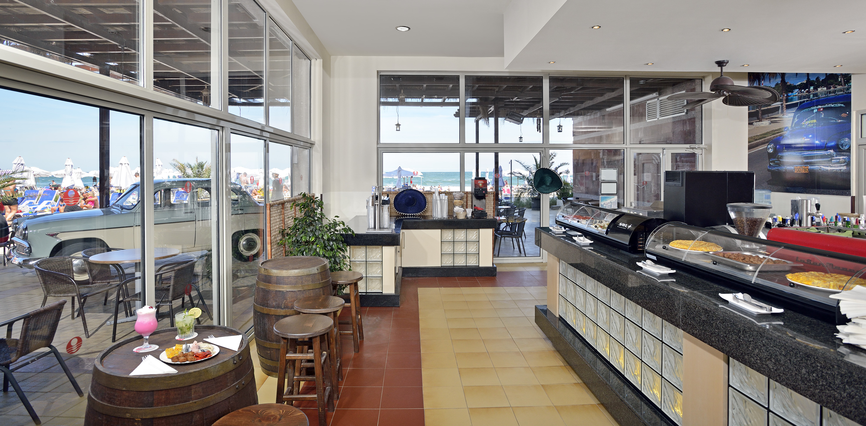 a room with a buffet and a large window