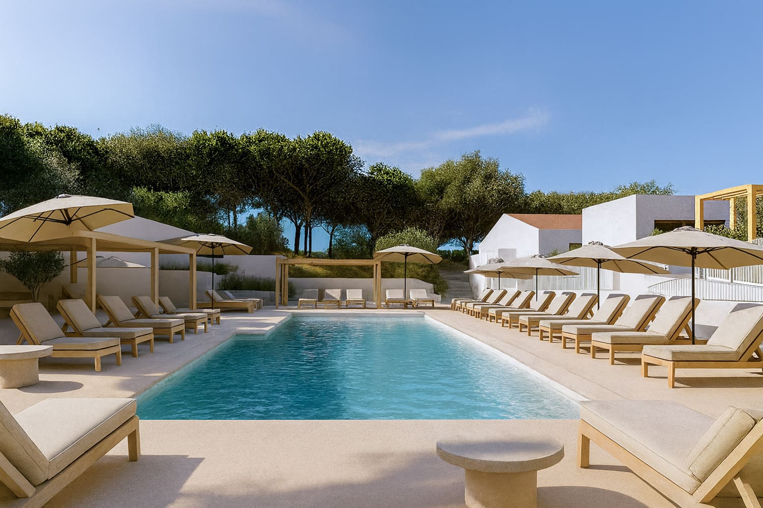a pool with lounge chairs and umbrellas