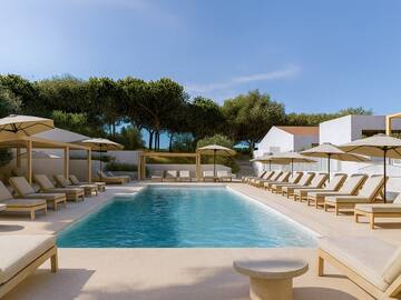 a pool with lounge chairs and umbrellas