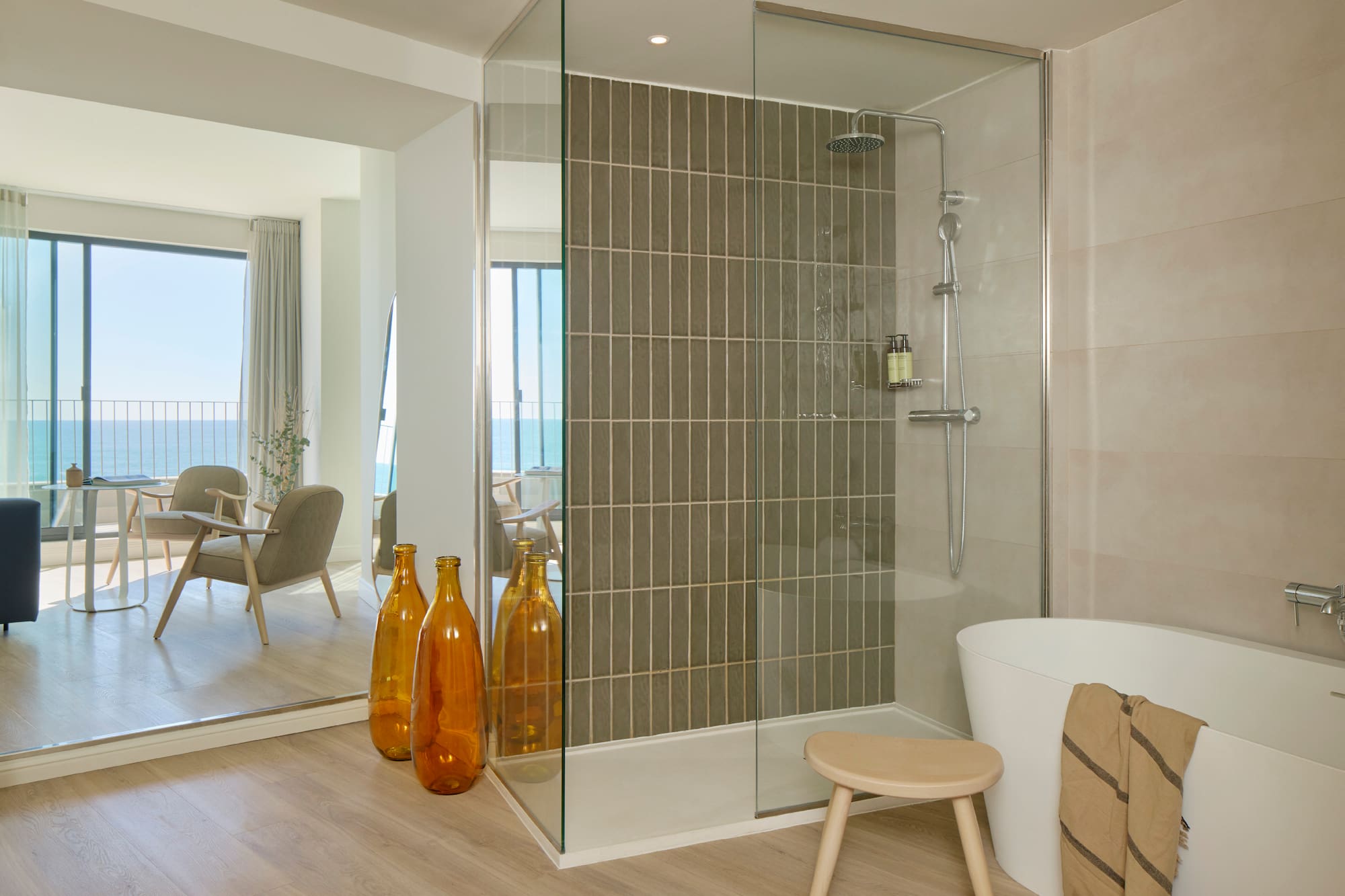 a bathroom with a tub and a shower