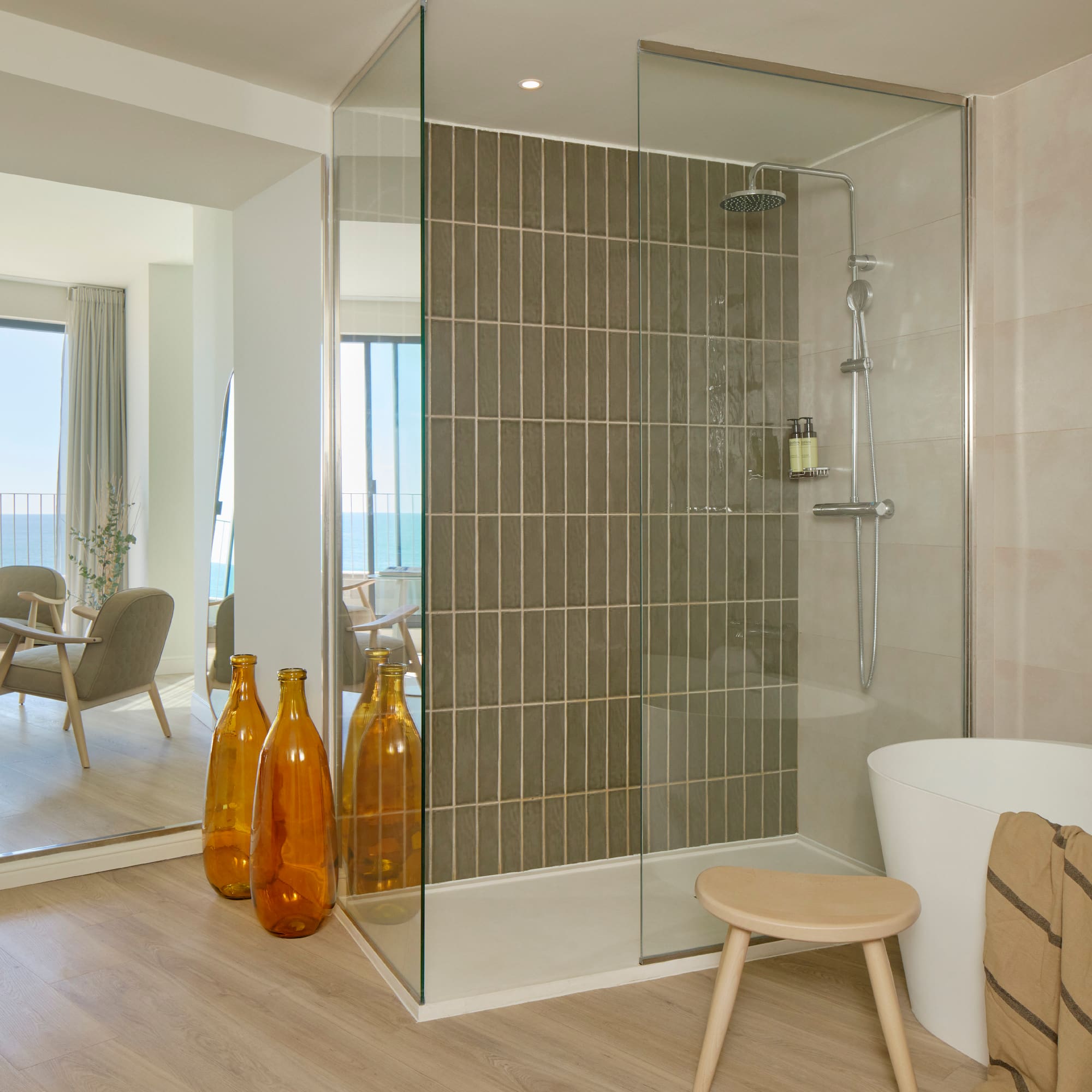 a bathroom with a tub and a shower