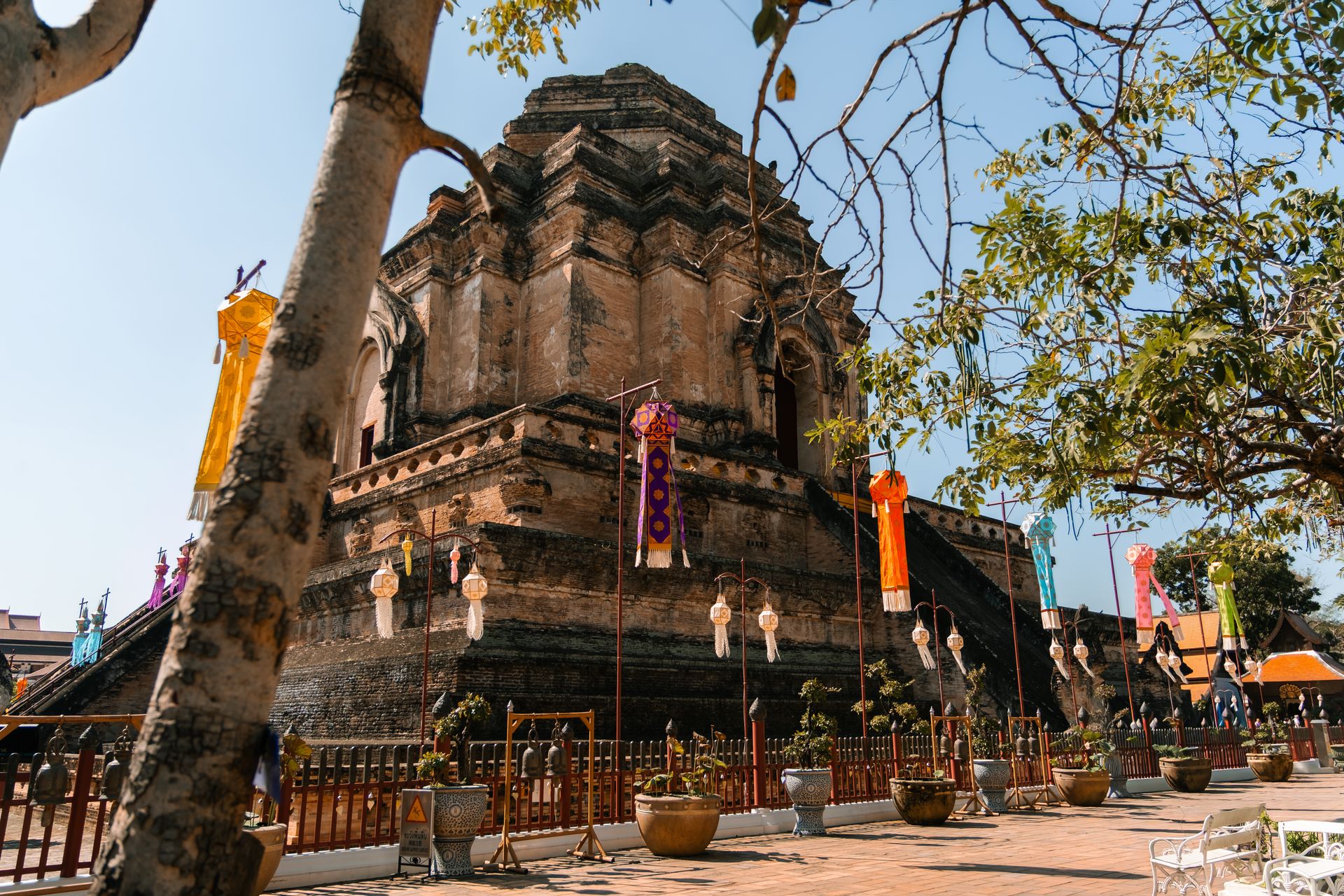 Wat Chedi Luang, Chiang Mai, ancient brick temple with colorful Lanna lanterns.