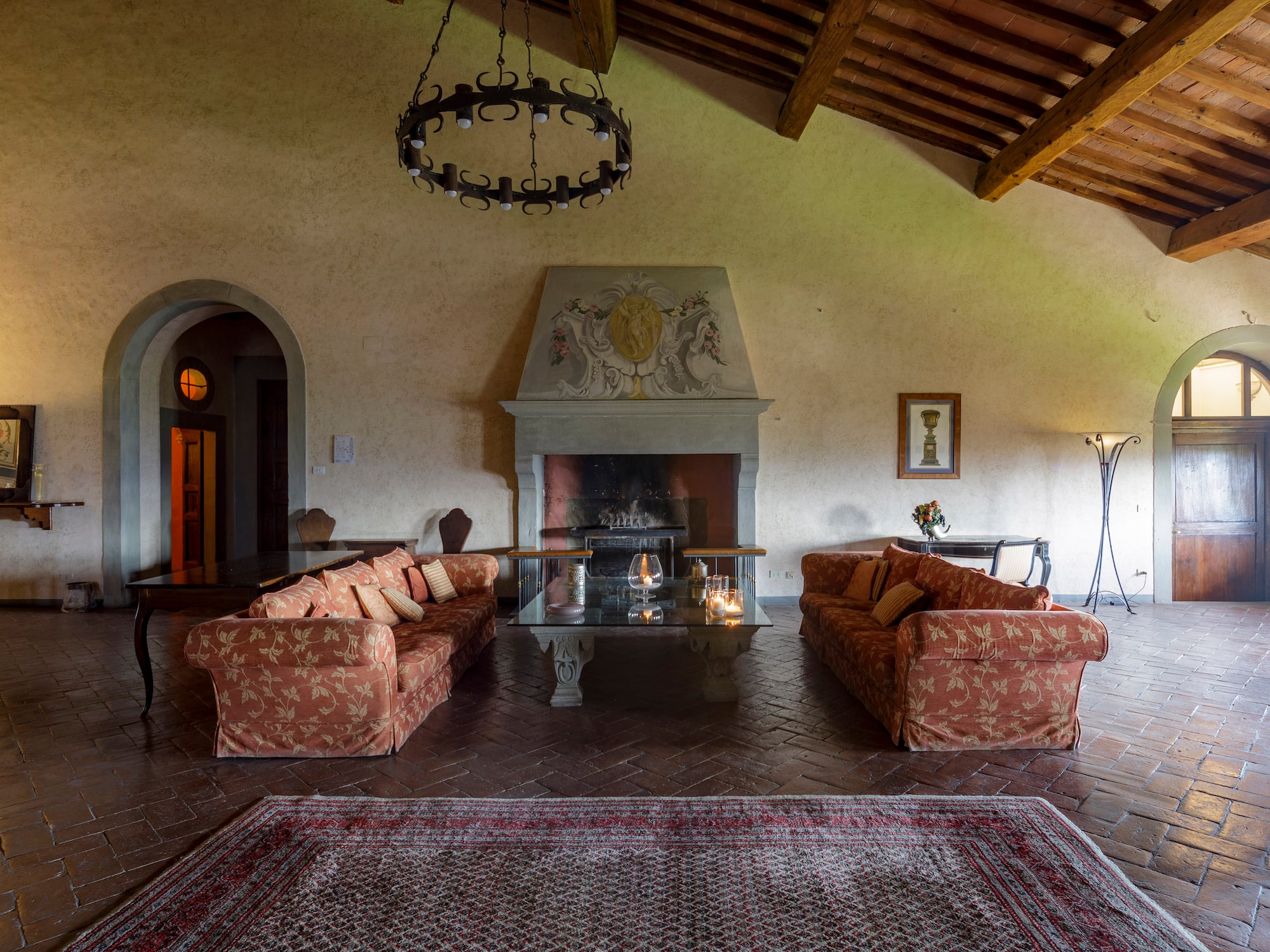 a living room with a fireplace and couches