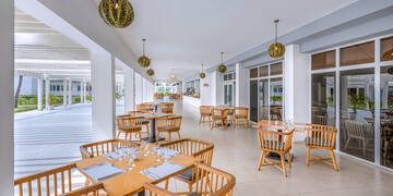 a restaurant with tables and chairs