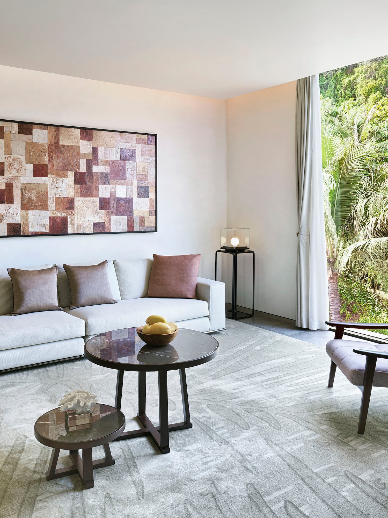 a living room with a couch and chairs