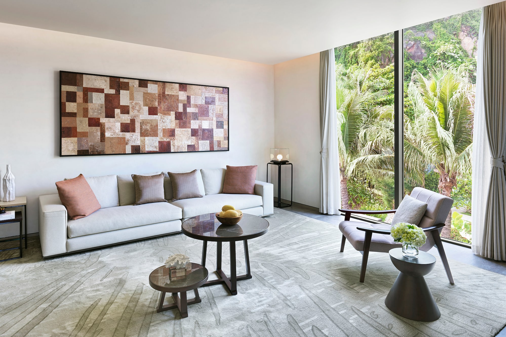 a living room with a couch and chairs