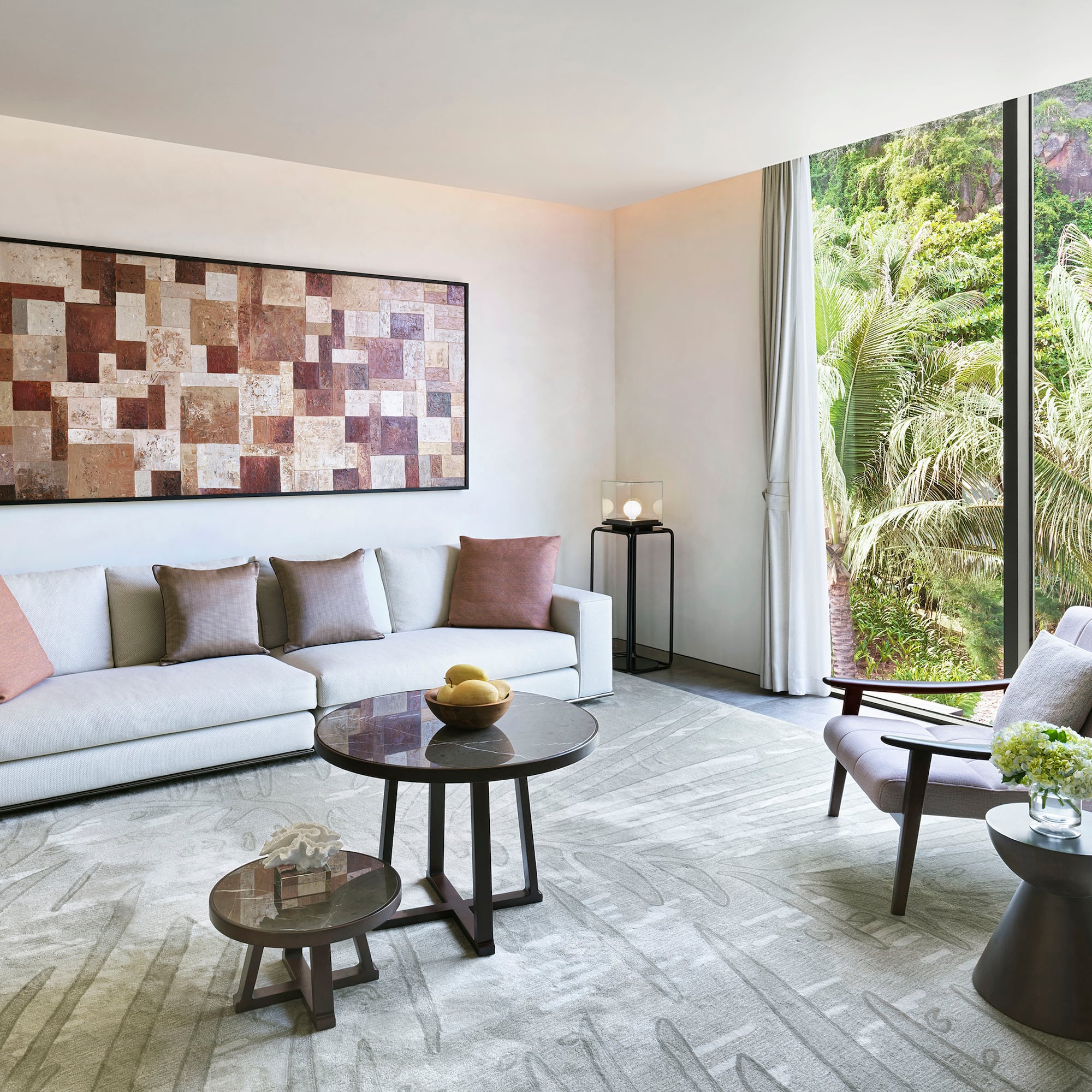 a living room with a couch and chairs