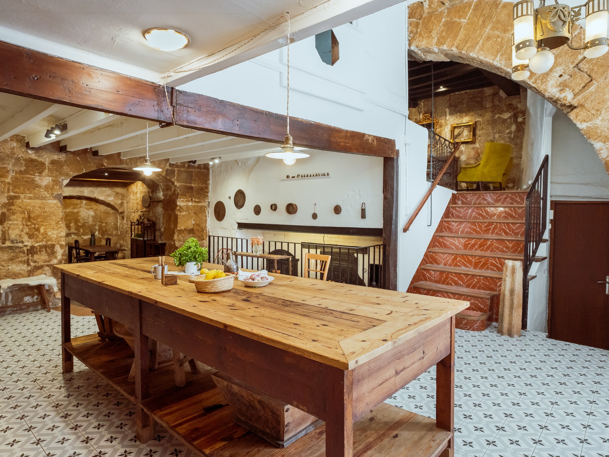 a table in a room with stairs and a staircase