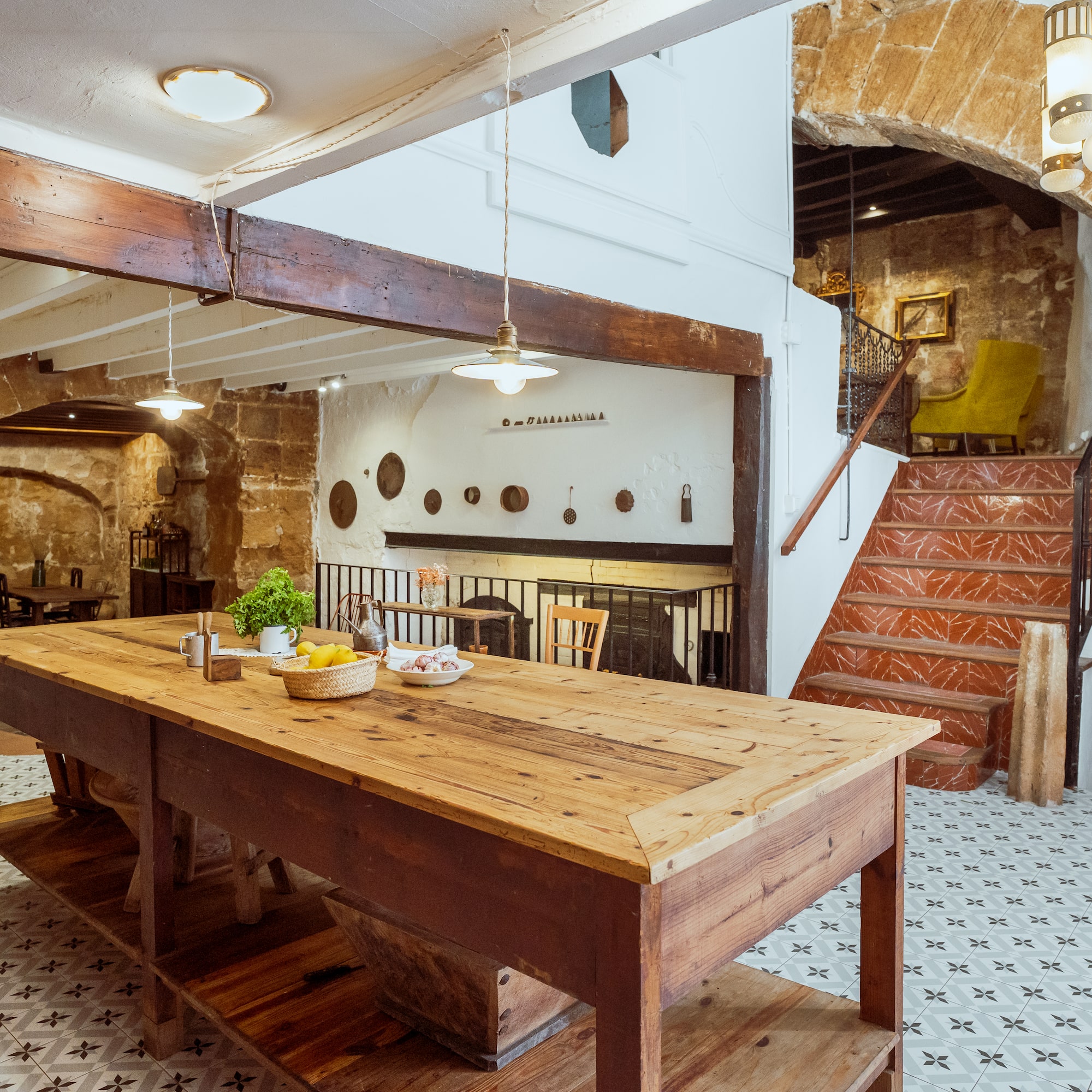 a table in a room with stairs and a staircase
