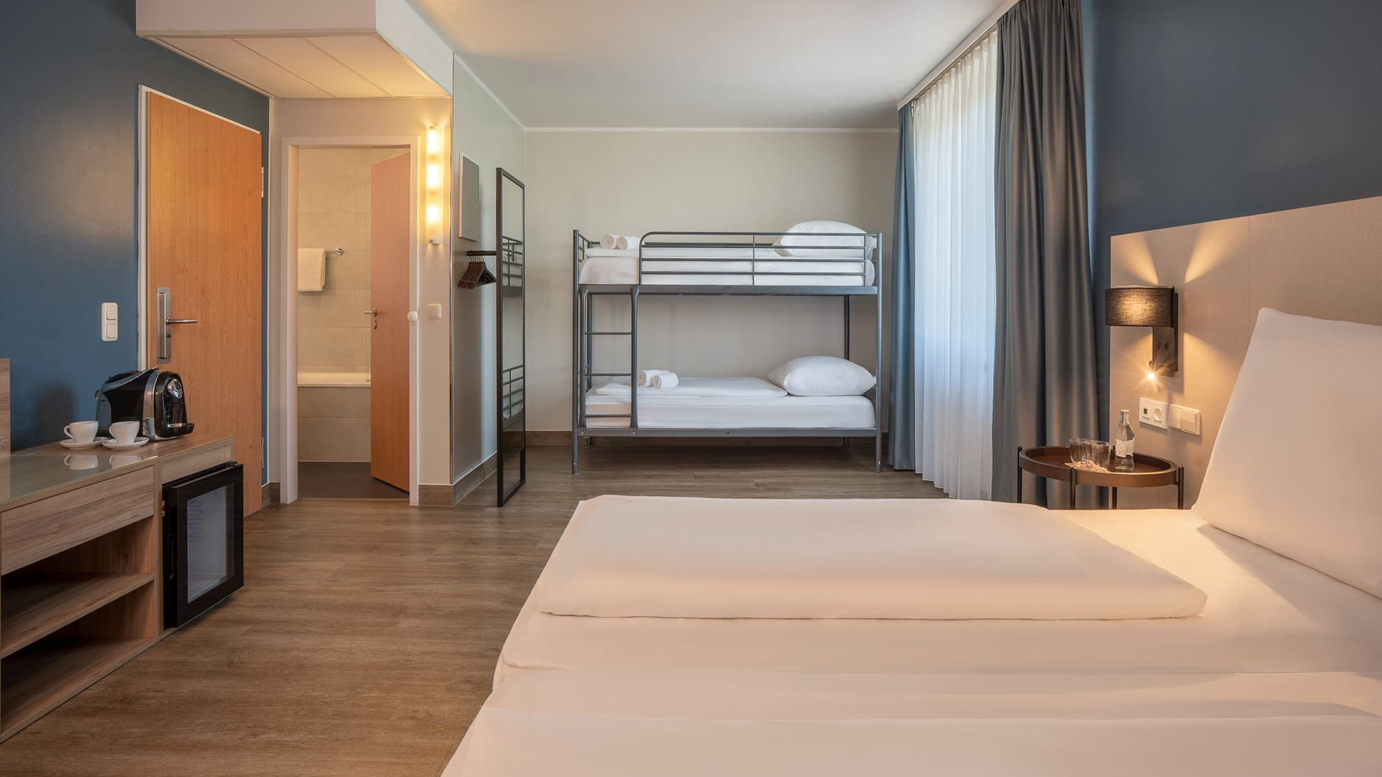 a room with bunk beds and a lamp