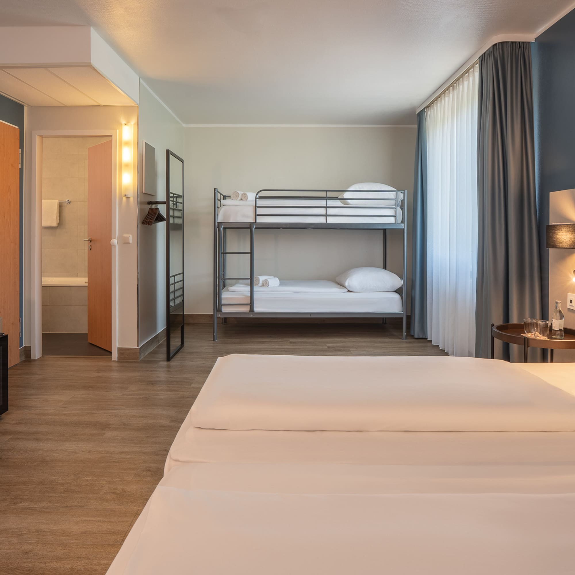 a room with bunk beds and a lamp