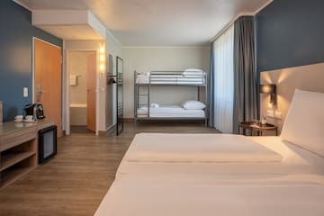 a room with bunk beds and a lamp