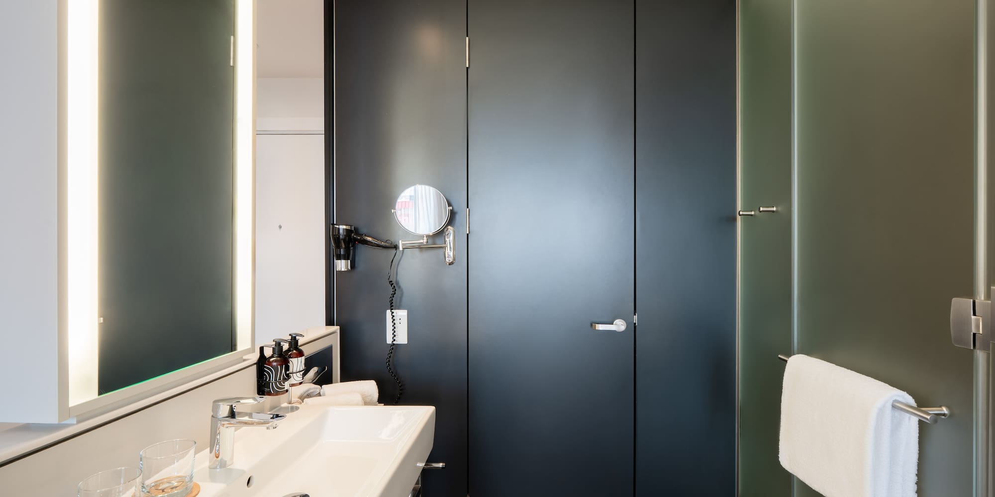 a bathroom with a sink and mirror