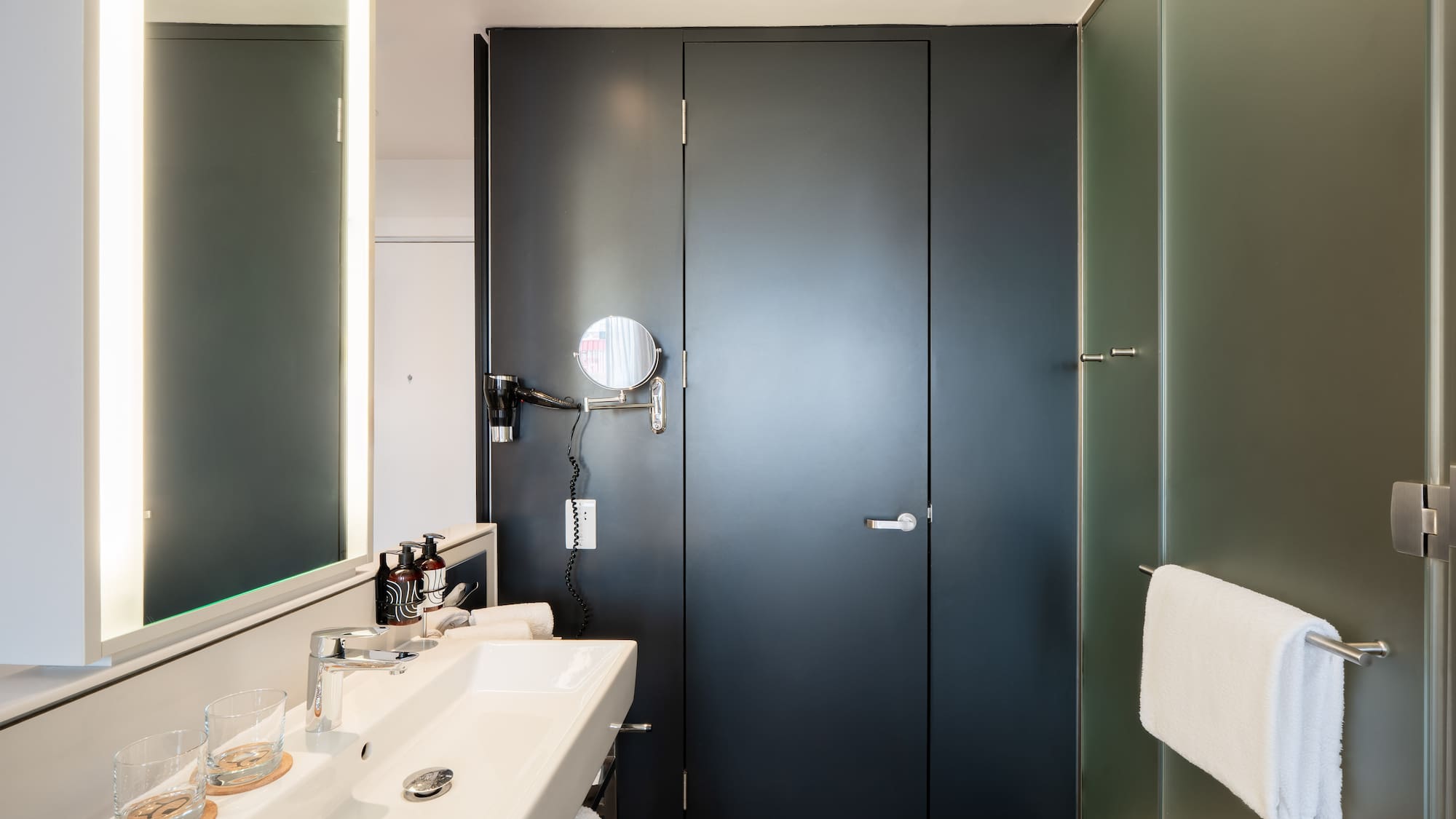 a bathroom with a sink and mirror