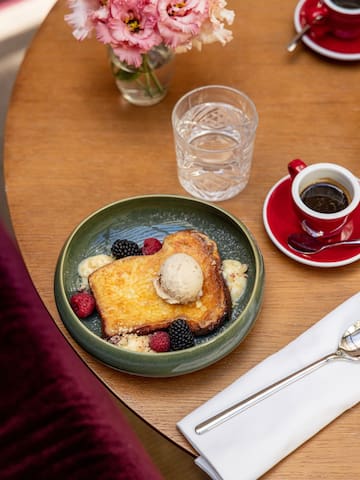 a plate of food and a cup of coffee