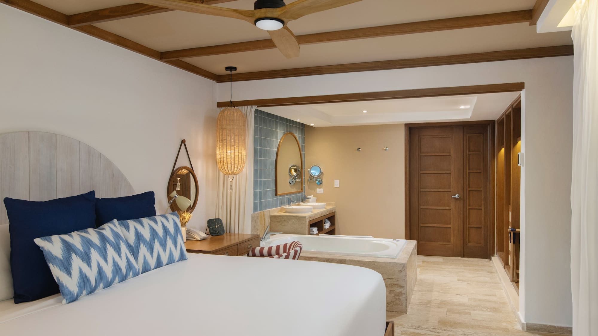 a room with a bed and a bathtub