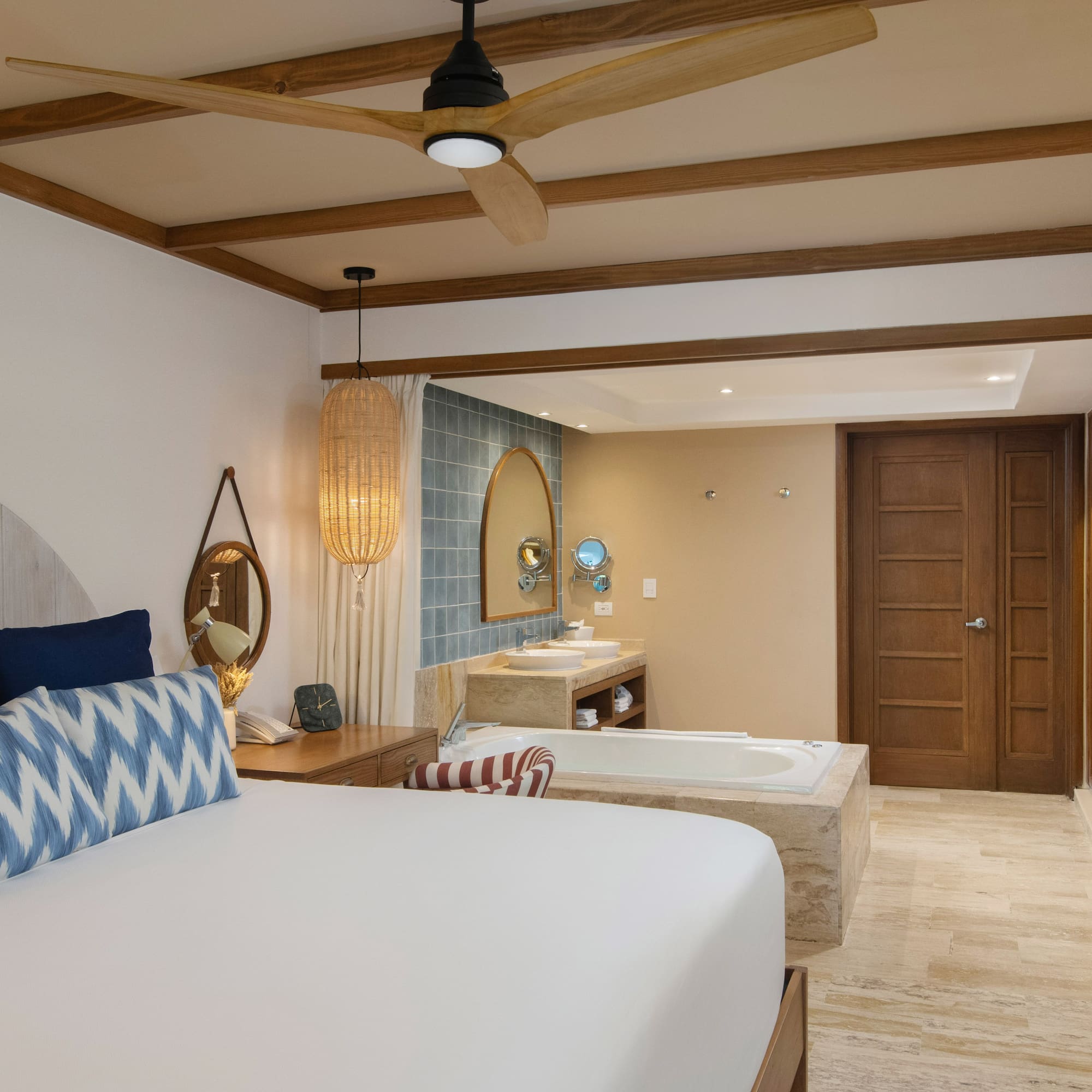 a room with a bed and a bathtub