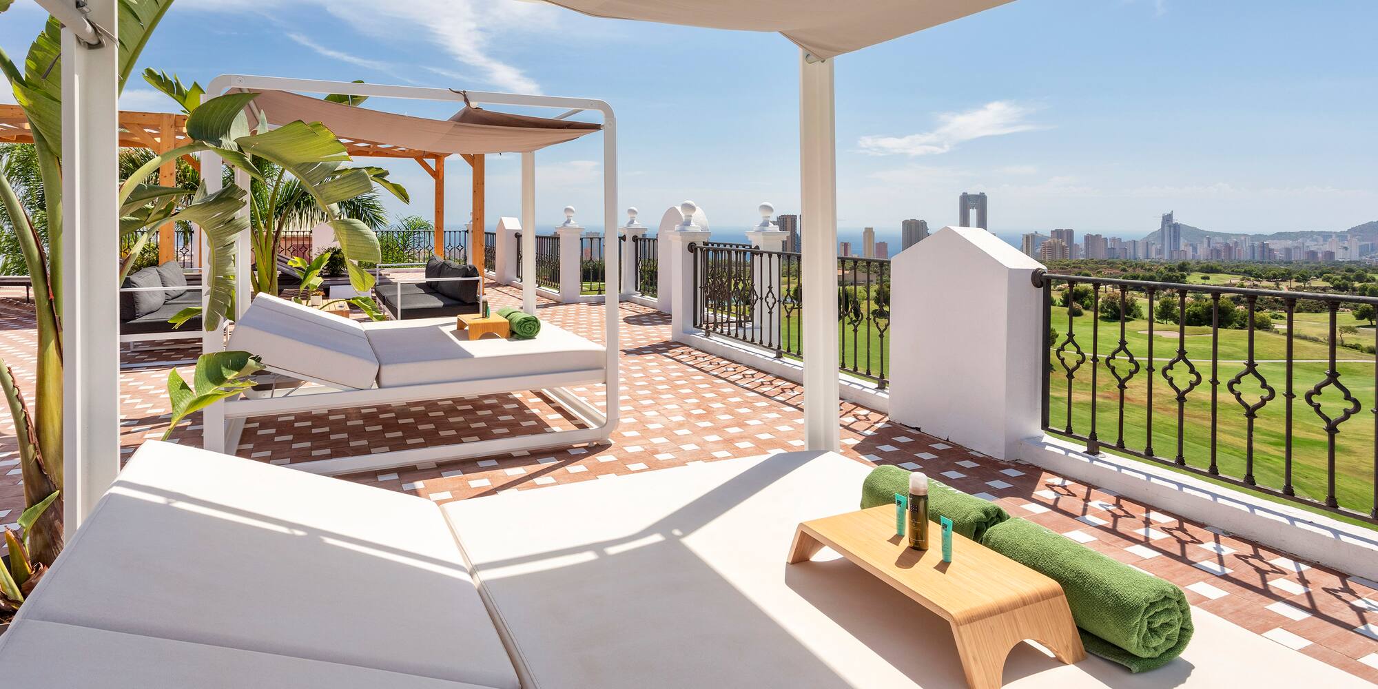 a patio with a view of a city and a city skyline