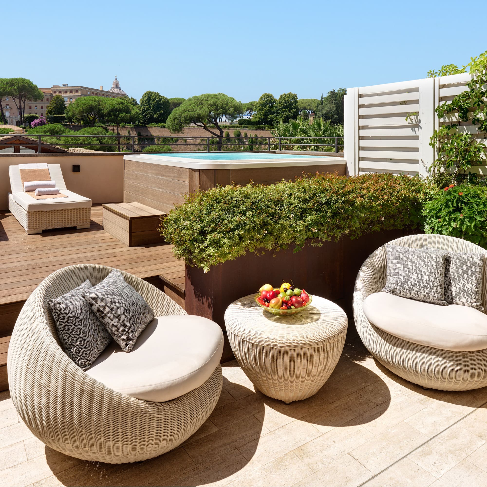 a patio with chairs and a pool