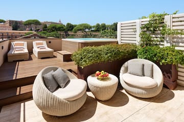 a patio with chairs and a pool